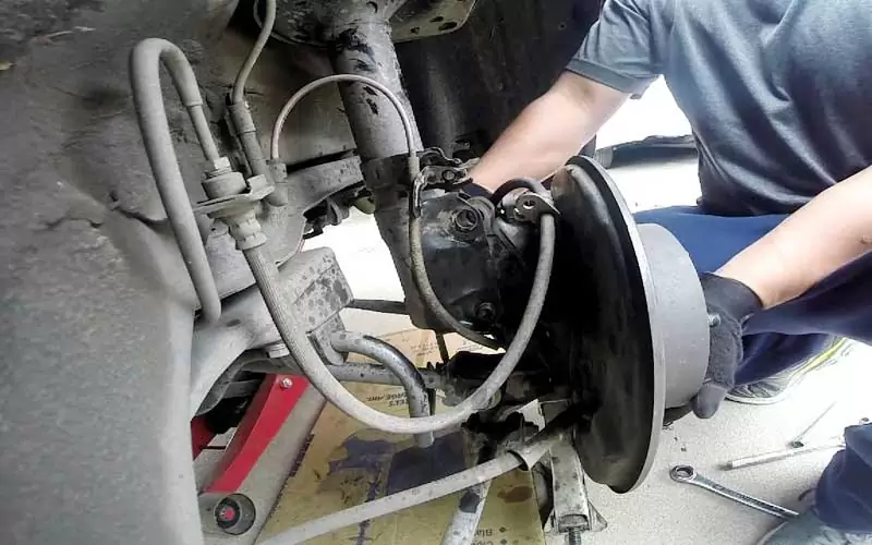 car-with-bad-struts Driving With Bad Struts - Steps, Dangers, How to Fix