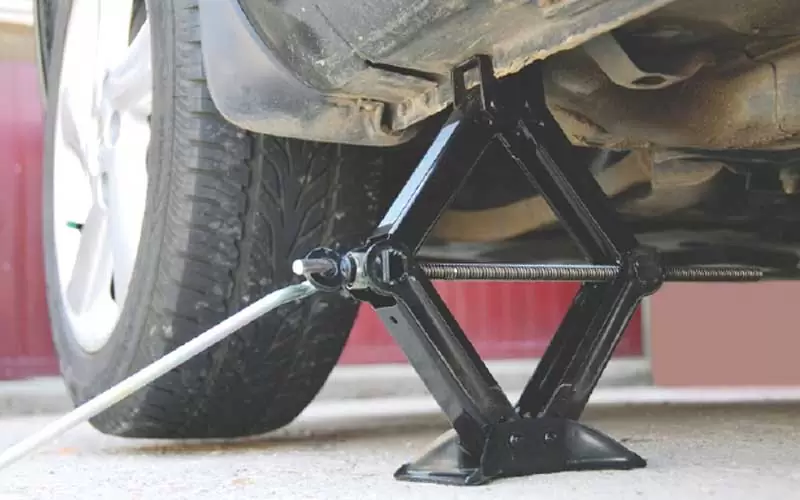 Pump-or-crank-the-jack How To Change Tire On Car - Step by Step Process