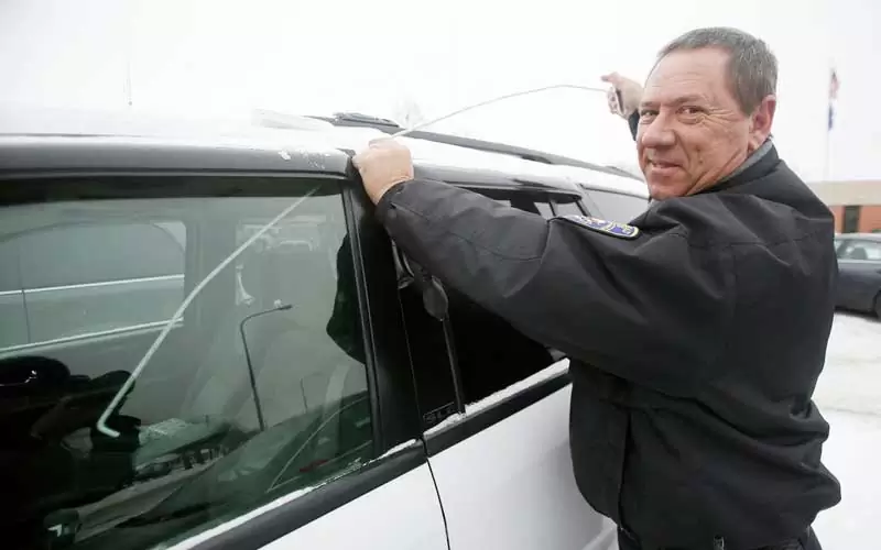 looking-through-the-window How to Unlock a Car with a Coat Hanger - Complete Process