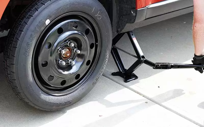 spare-tire-and-the-jack How To Change Tire On Car - Step by Step Process